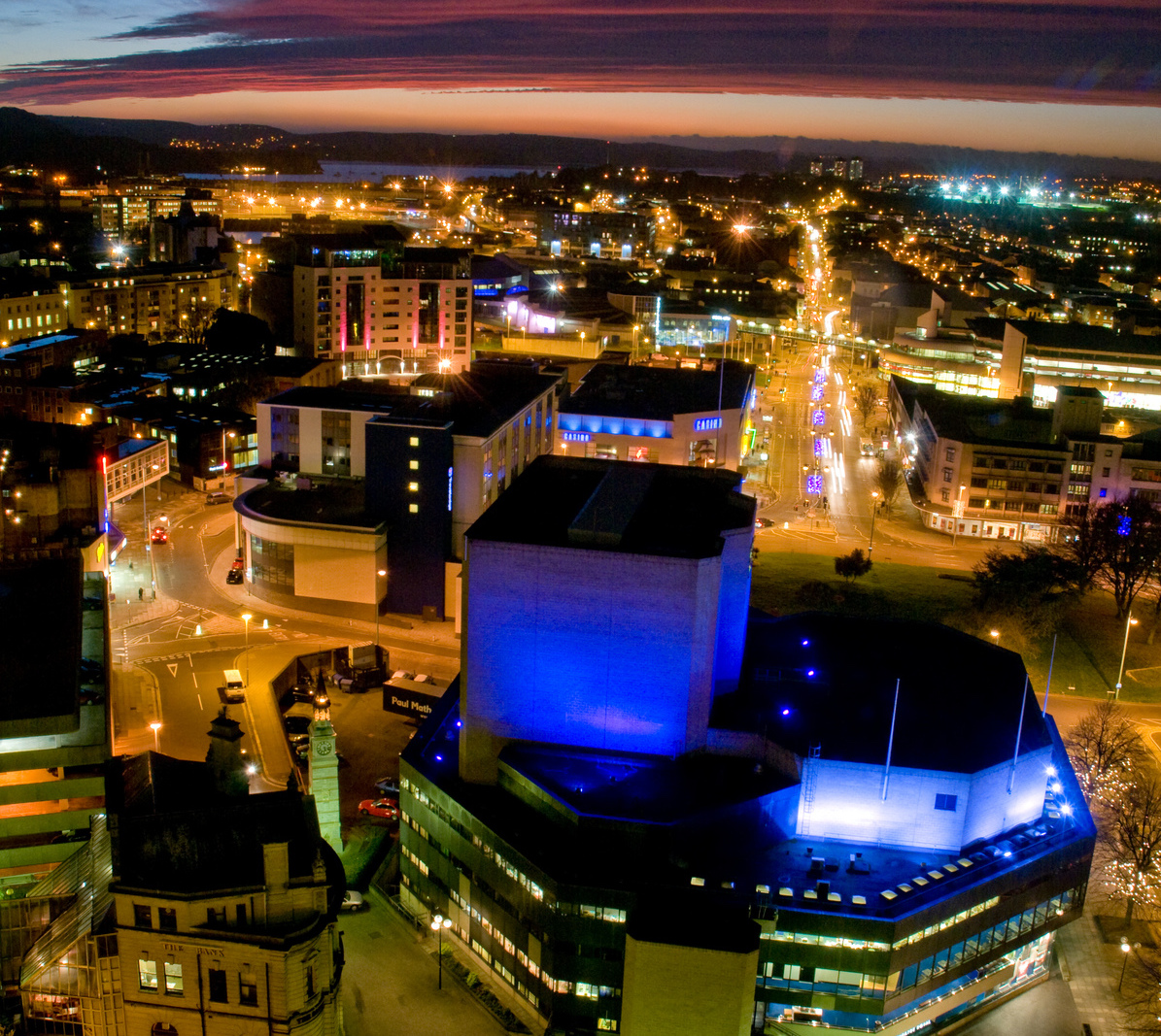 image of Plymouth buildings lit up at night