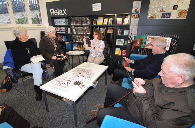 Group session in library delivering basic digital skills