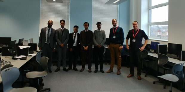 Image of students, teacher and visitors from DCMS at the UTC.